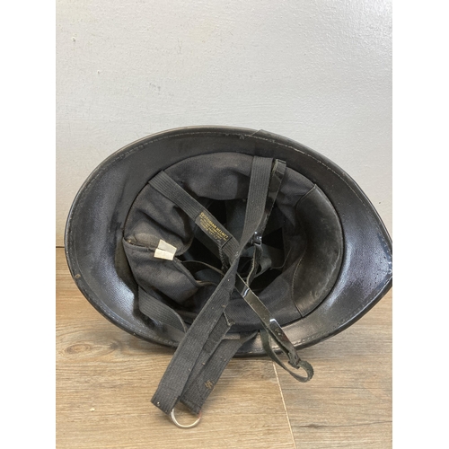 540 - Three police helmets and caps, two with Cheshire Constabulary badges