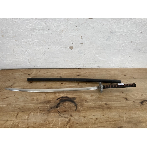 547 - A mid to late 20th century ornamental samurai sword with scabbard - approx. 99cm long