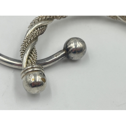 1193 - Four white metal cuff bracelets to include one stamped .925 - approx. gross weight 70 grams