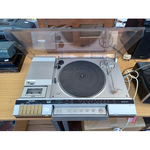 632 - A Sharp SG-280 stereo music centre comprising 
two-speed turntable, three-band tuner/amplifier and D... 