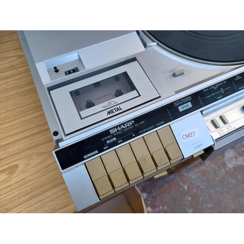 632 - A Sharp SG-280 stereo music centre comprising 
two-speed turntable, three-band tuner/amplifier and D... 