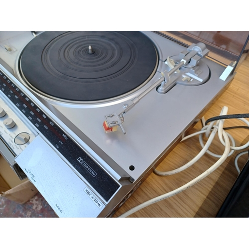 632 - A Sharp SG-280 stereo music centre comprising 
two-speed turntable, three-band tuner/amplifier and D... 