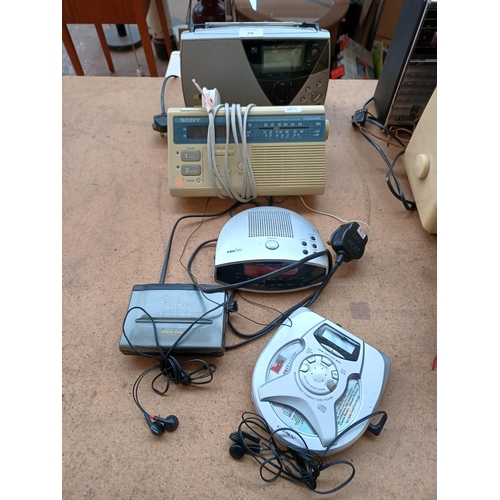 636 - Five items to include Roberts R9905 three-band portable radio, Sony three-band radio alarm clock etc... 