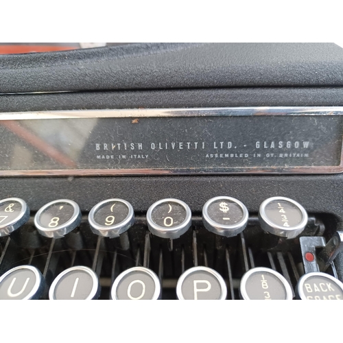 768A - Two vintage portable typewriters, one Olivetti and one Silver-Reed Leader