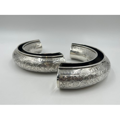 1252 - A pair of late 19th/early 20th century Middle Eastern white metal half moon posy bowls - approx. gro... 