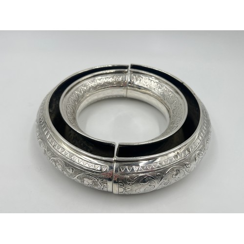 1252 - A pair of late 19th/early 20th century Middle Eastern white metal half moon posy bowls - approx. gro... 