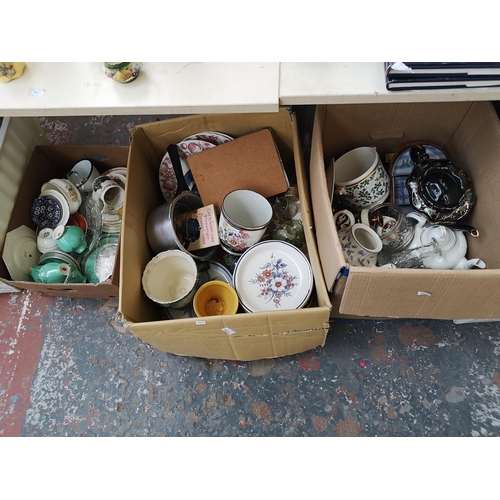 973B - Five boxes containing ceramics, glassware, clothing etc.