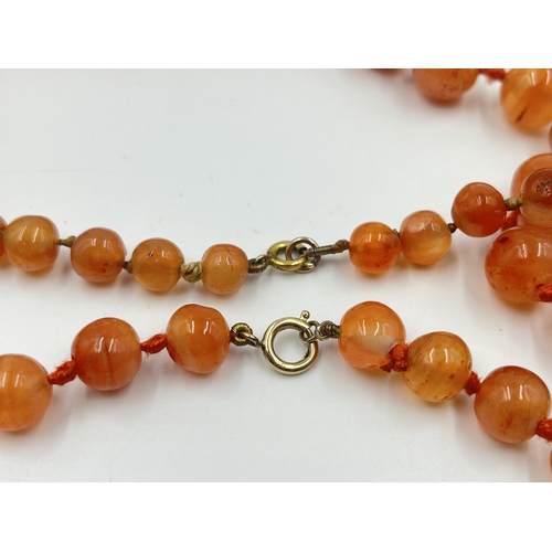 1183 - Two Art Deco carnelian beaded necklaces, one with 9ct gold clasp - approx. gross weight 115 grams