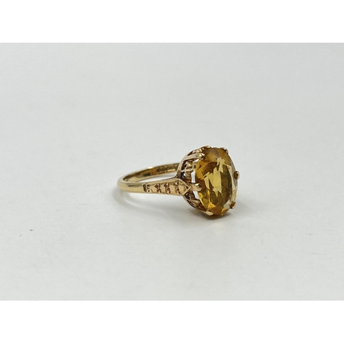 1188 - A 9ct gold yellow topaz solitaire ring, hallmarked Birmingham 1973, size O½ - approx. gross weight 3... 