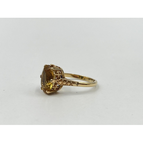 1188 - A 9ct gold yellow topaz solitaire ring, hallmarked Birmingham 1973, size O½ - approx. gross weight 3... 