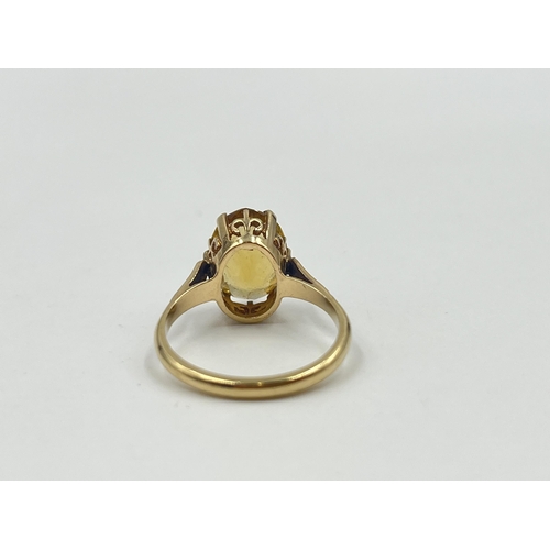 1188 - A 9ct gold yellow topaz solitaire ring, hallmarked Birmingham 1973, size O½ - approx. gross weight 3... 