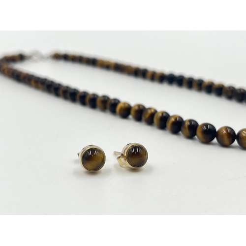 1189 - Two pieces of tiger's eye jewellery, one beaded necklace with white metal clasp and one pair of 9ct ... 