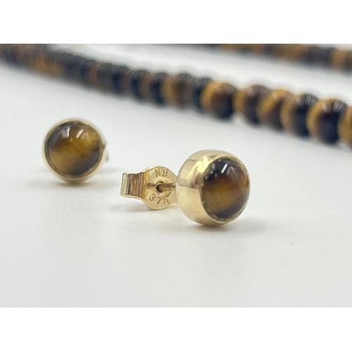 1189 - Two pieces of tiger's eye jewellery, one beaded necklace with white metal clasp and one pair of 9ct ... 