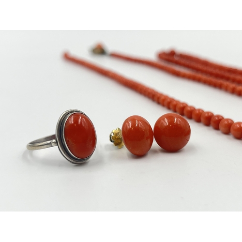 1190 - Four pieces of coral jewellery to include a pair of stamped 18ct gold earrings - approx. gross weigh... 