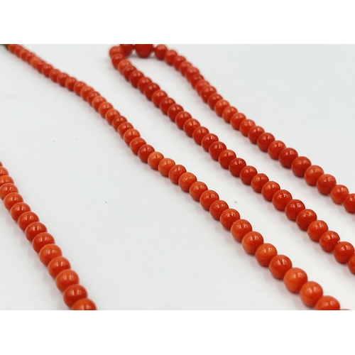 1190 - Four pieces of coral jewellery to include a pair of stamped 18ct gold earrings - approx. gross weigh... 