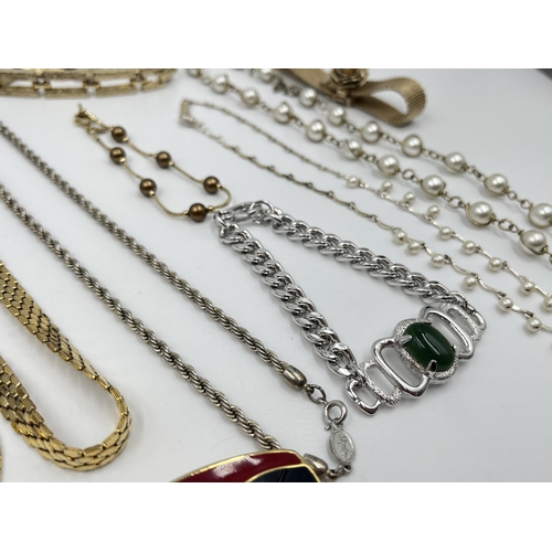 1202 - A collection of vintage costume jewellery to include two Sarah Coventry bracelets, Monet gold tone a... 