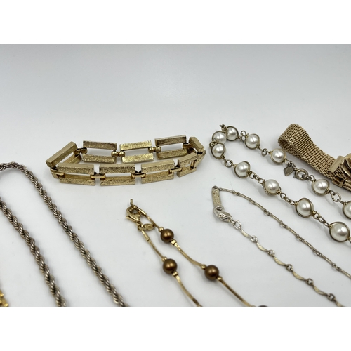 1202 - A collection of vintage costume jewellery to include two Sarah Coventry bracelets, Monet gold tone a... 