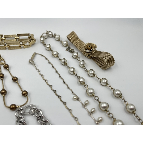 1202 - A collection of vintage costume jewellery to include two Sarah Coventry bracelets, Monet gold tone a... 