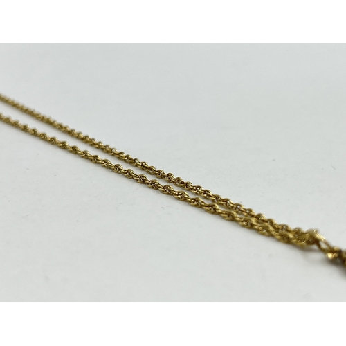 1213 - A hallmarked 9ct gold chain necklace with unmarked yellow metal cross pendant - approx. gross weight... 