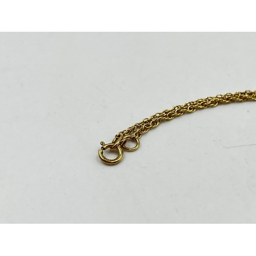 1213 - A hallmarked 9ct gold chain necklace with unmarked yellow metal cross pendant - approx. gross weight... 