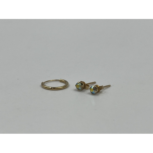 1218 - Three earrings, one unmarked yellow metal earring and two stamped .585 CZ earrings - approx. gross w... 