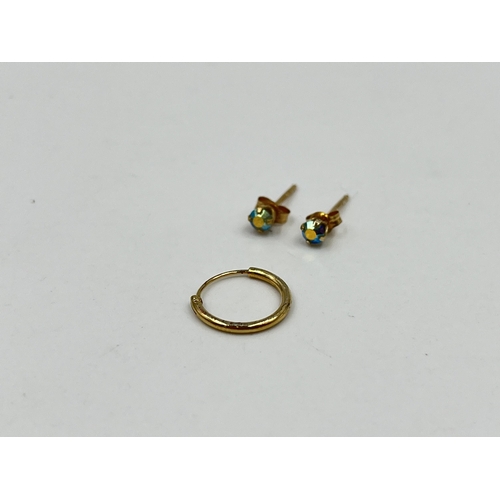 1218 - Three earrings, one unmarked yellow metal earring and two stamped .585 CZ earrings - approx. gross w... 