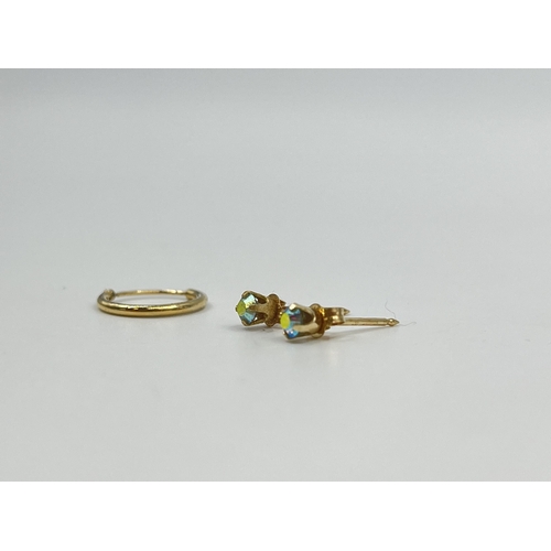 1218 - Three earrings, one unmarked yellow metal earring and two stamped .585 CZ earrings - approx. gross w... 