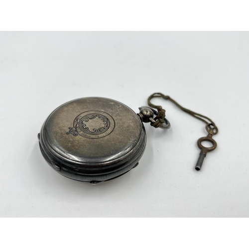 1219 - A Victorian hallmarked Chester silver cased open face key wind pocket watch and key by Samuel Yeoman... 