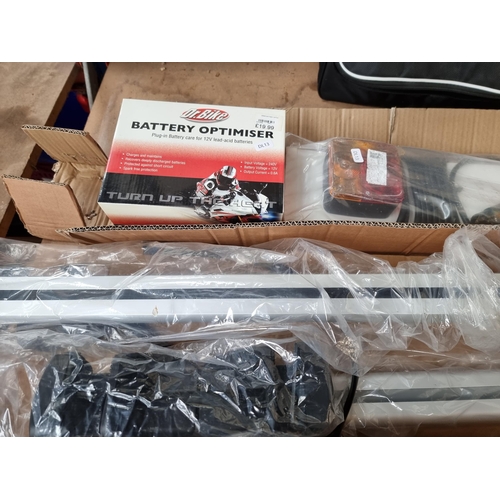 858 - A collection of car equipment to include a pair of car roof racks, boxed Dr. Bike battery optimizer,... 