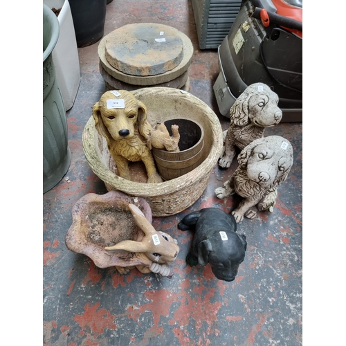 919 - Six garden items, four dogs ornaments, one rabbit ornament and one cast stone planter