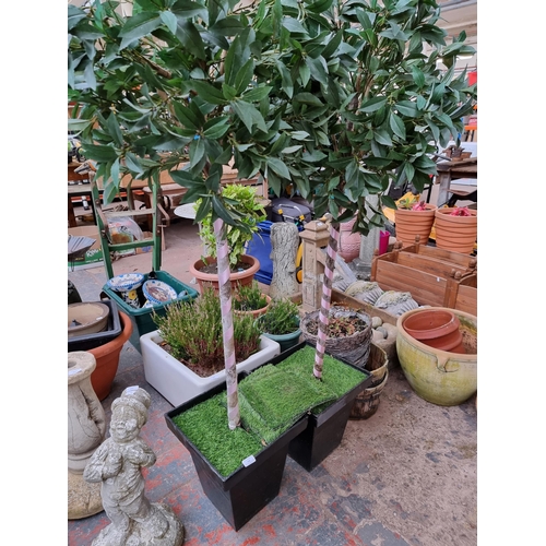 936 - A pair of artificial potted trees