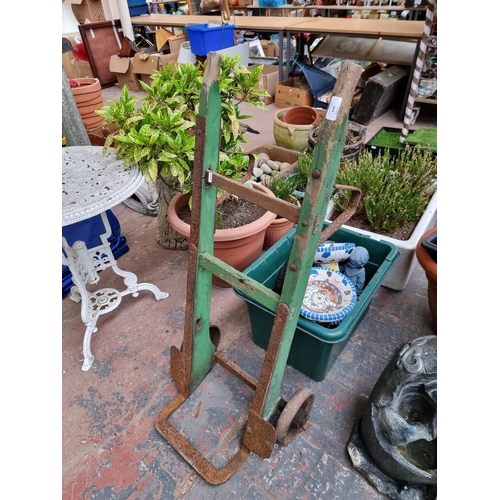 939 - An early 20th century wooden and cast metal sack truck