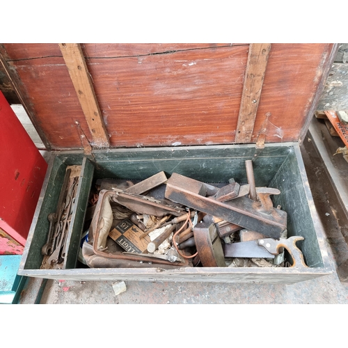 954 - A Victorian pine blanket box containing antique and later hand tools