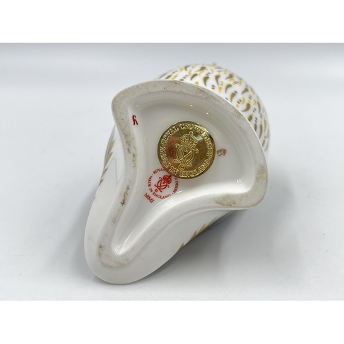 252 - A Royal Crown Derby Puffin paperweight with gold stopper