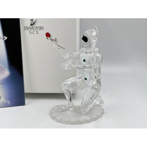 255 - A boxed Swarovski Crystal Masquerade Harlequin figurine - approx. 13cm high