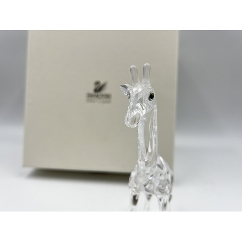 259 - A boxed Swarovski Crystal Baby Giraffe figurine, model no. 236717