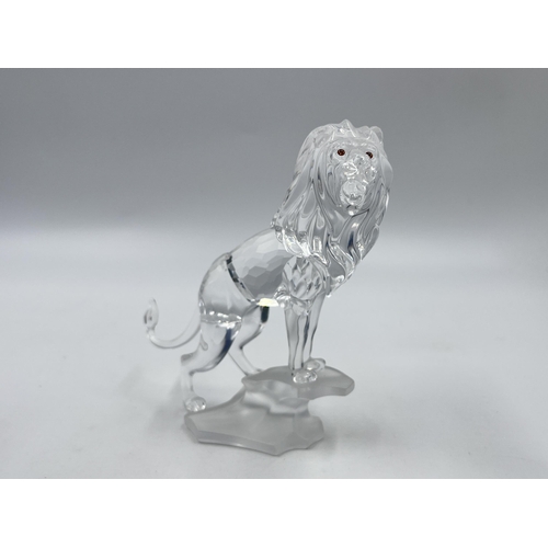 278 - A boxed Swarovski Crystal Lion figurine - model no. 269377