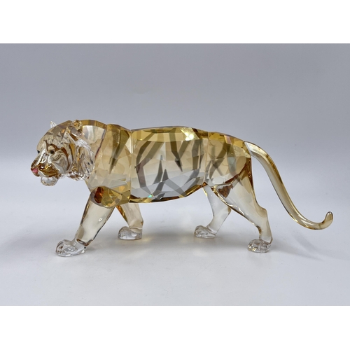 285 - A boxed Swarovski Crystal Endangered Wildlife Tiger figurine - model no. 1003148