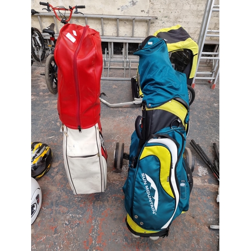 821 - Two golf bags containing clubs to include The Rogue Knight DI19, MacGregor Comp, Regal etc.