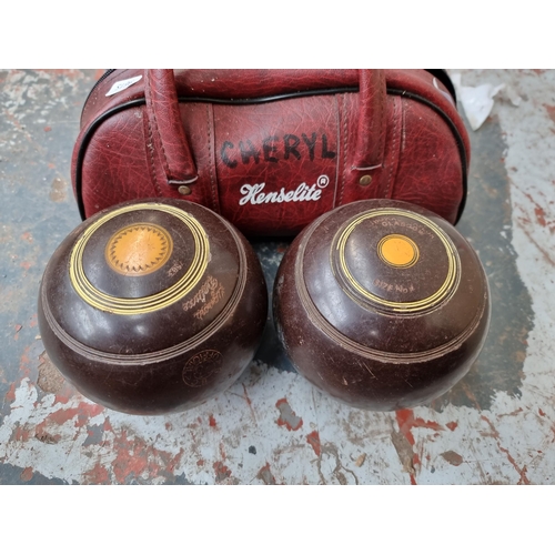 825 - A pair of vintage cased Thomas Taylor size no. 4  lignum vitae bowls