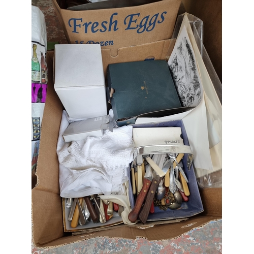 975B - Three boxes containing cutlery, ceramics, crochet magazines etc.