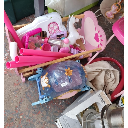 976 - A collection of house clearance items to include wall lights, foot spa massager, children's toys etc... 