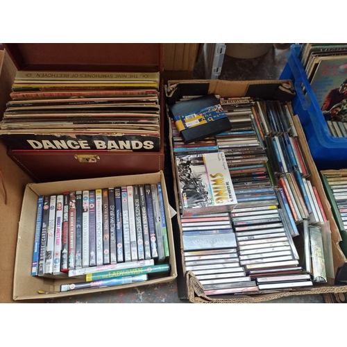 979 - Six boxes containing a large quantity of DVDs, CDs and vinyl records