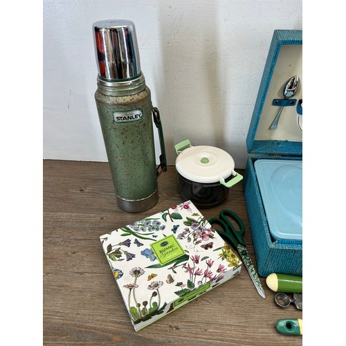 354 - A collection of kitchenalia to include Aladdin Stanley Thermos, picnic set etc.