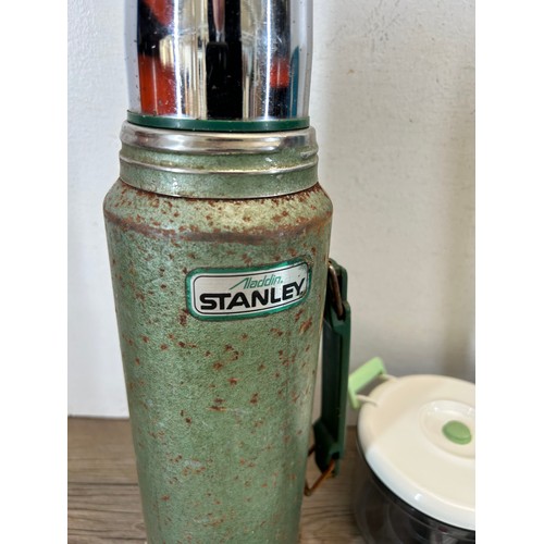 354 - A collection of kitchenalia to include Aladdin Stanley Thermos, picnic set etc.