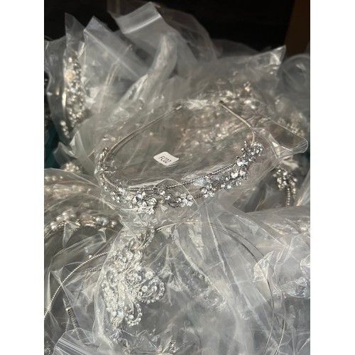 961B - Four boxes containing a large quantity of tiaras