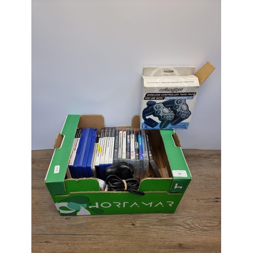 746 - A box containing Sony PlayStation games and accessories