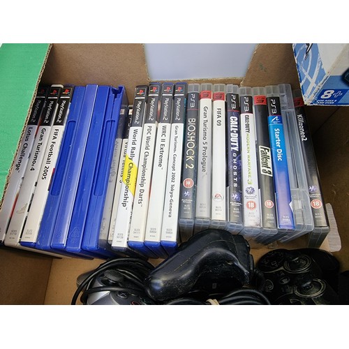 746 - A box containing Sony PlayStation games and accessories