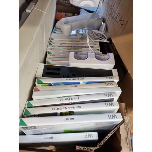 748 - Two boxes containing Nintendo Wii consoles games and accessories