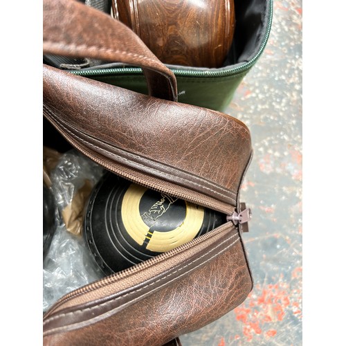 827 - Seven cased bowls to include lignum vitae, R.W. Hensell & Sons Henselite etc.